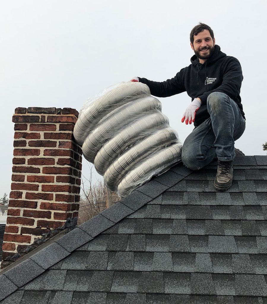 Isaac Windle owner of Universal Chimney on roof